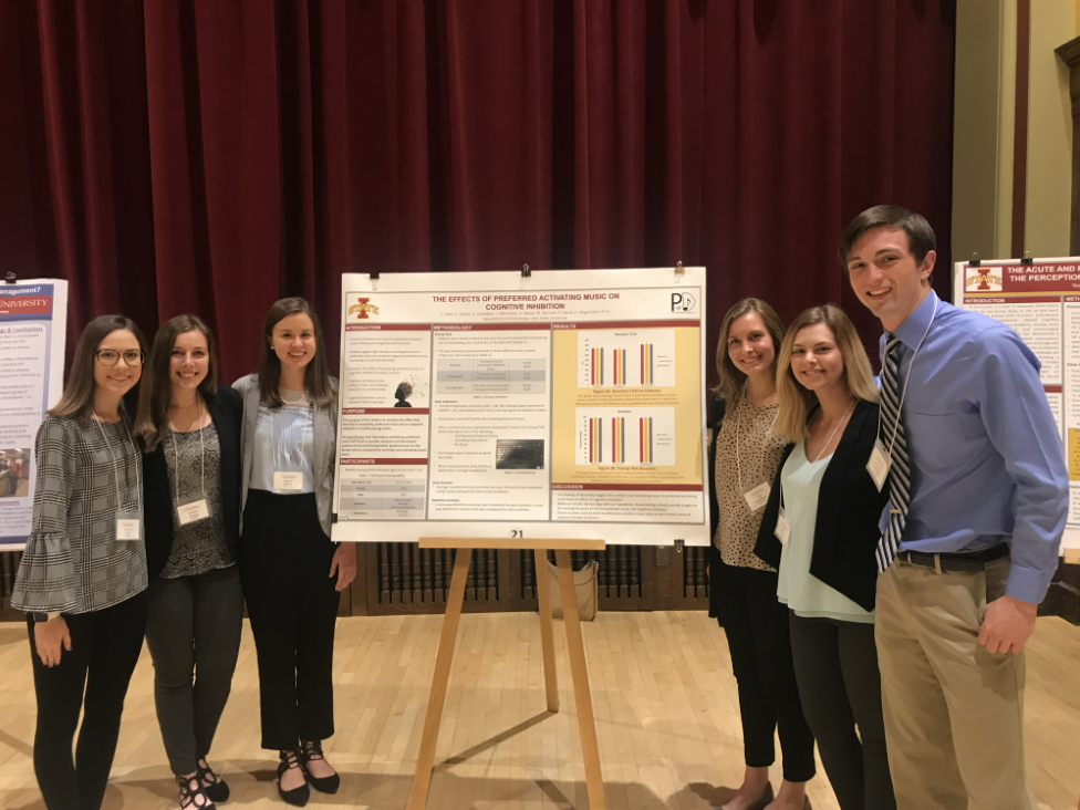 Six students presenting their research findings