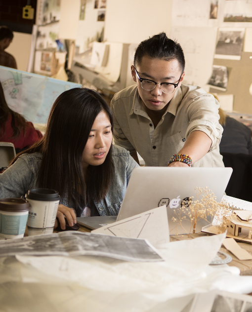 Two students looking at a computer